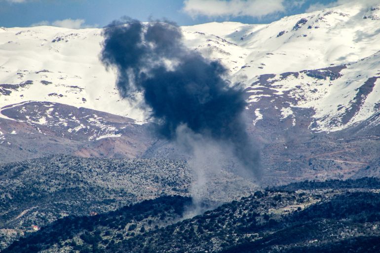 Smoke billows above hills following an Israeli strike on the Lebanese side of the disputed Shebaa Farms district in southern Lebanon on March 10