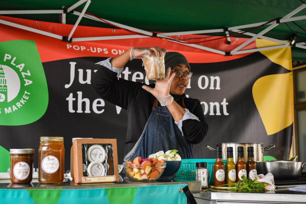 Chef Sarah Germany holds up a tub of smoked catfish during her Foodwise Demo