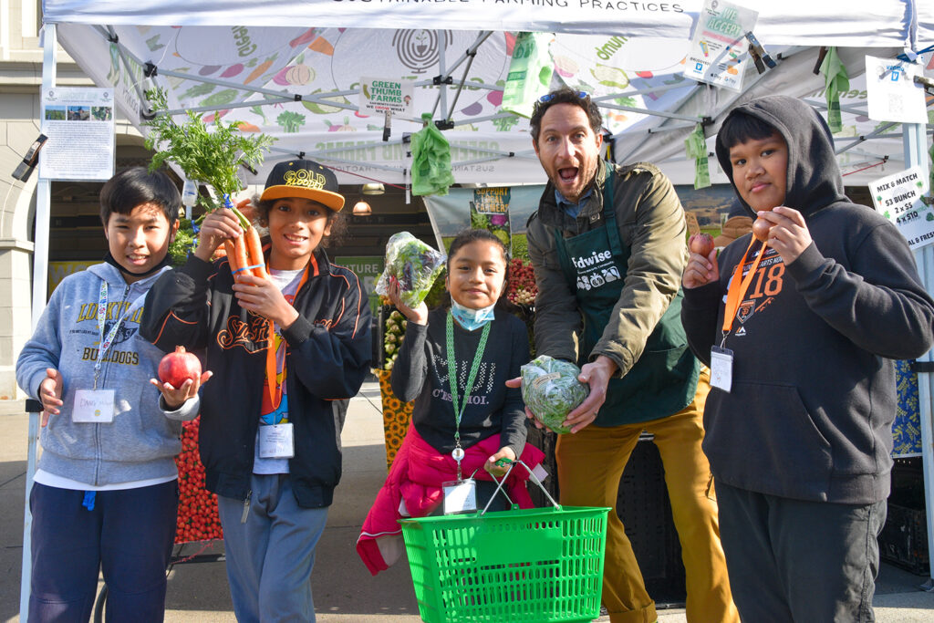 Foodwise Kids group holding produce